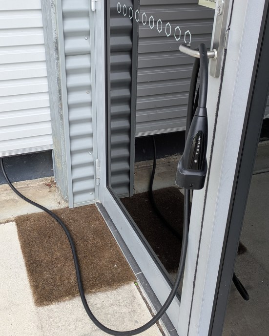 Home EV charger cable at an ivygo host’s garage door